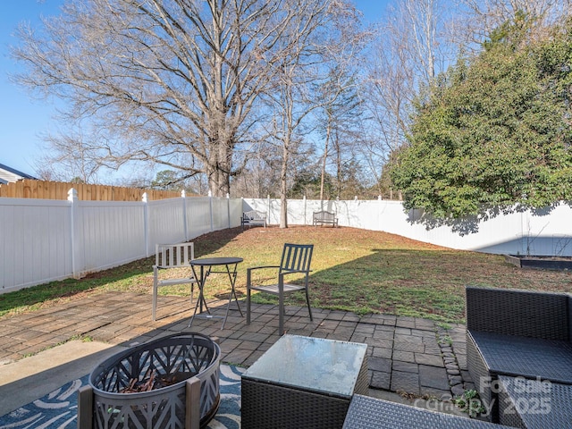 view of patio featuring an outdoor fire pit