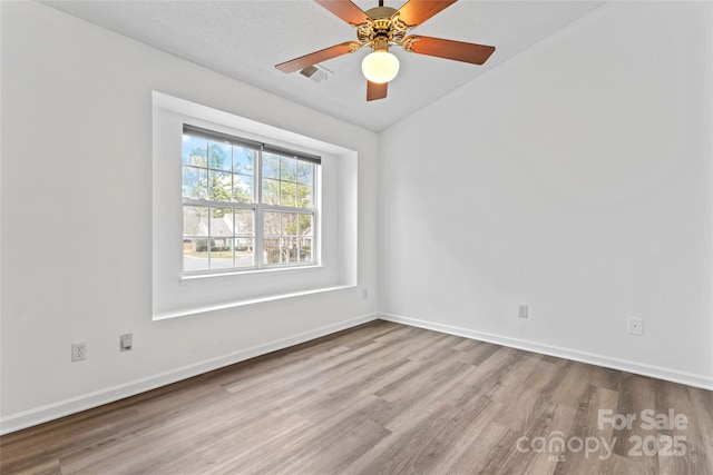 unfurnished room with light hardwood / wood-style floors and ceiling fan