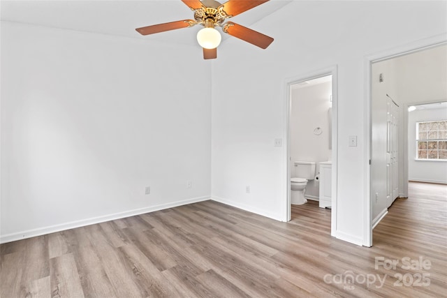 unfurnished bedroom with light hardwood / wood-style floors, ceiling fan, and ensuite bathroom