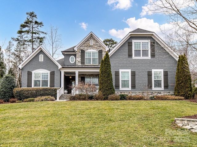 view of front of house featuring a porch and a front yard