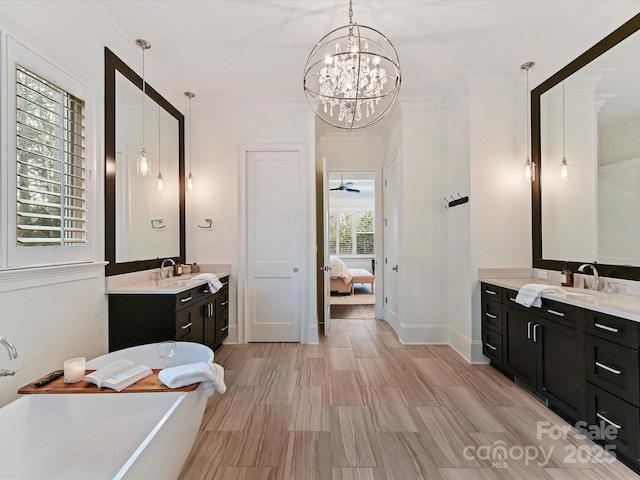 bathroom with vanity and a tub to relax in