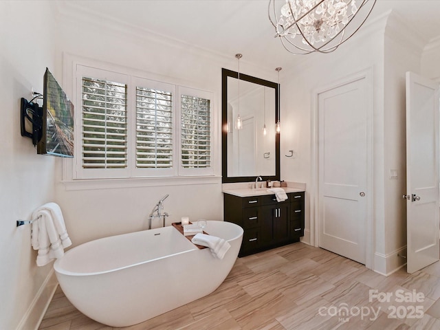 bathroom with vanity and a tub