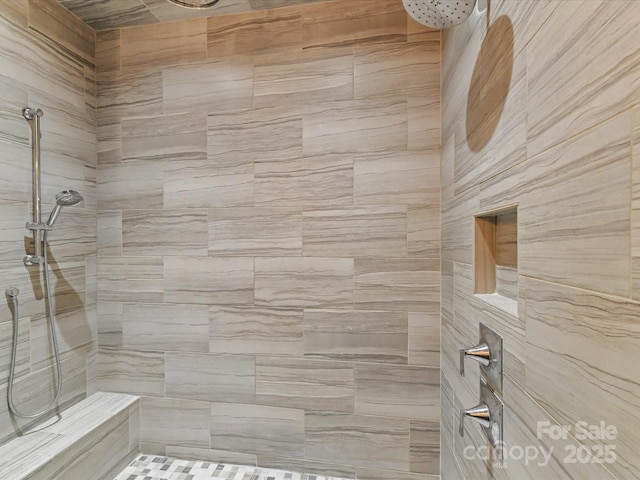 bathroom featuring tiled shower