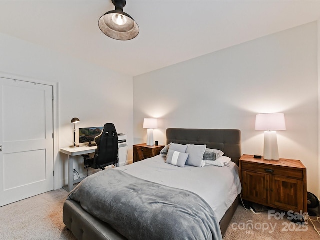 bedroom featuring light carpet