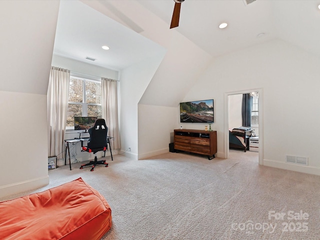 sitting room featuring vaulted ceiling and light carpet