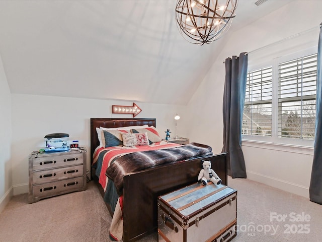 carpeted bedroom with vaulted ceiling