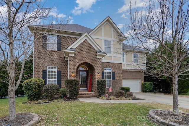 view of front of house with a garage and a front yard