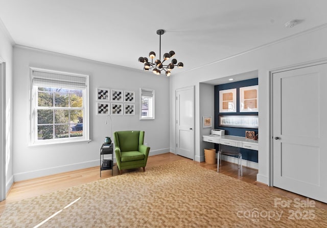 sitting room featuring hardwood / wood-style flooring and a chandelier