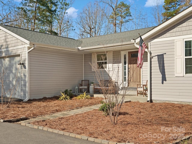 property entrance with a garage