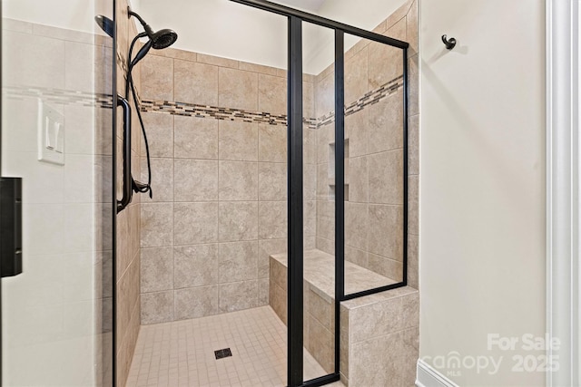 bathroom with a shower with shower door