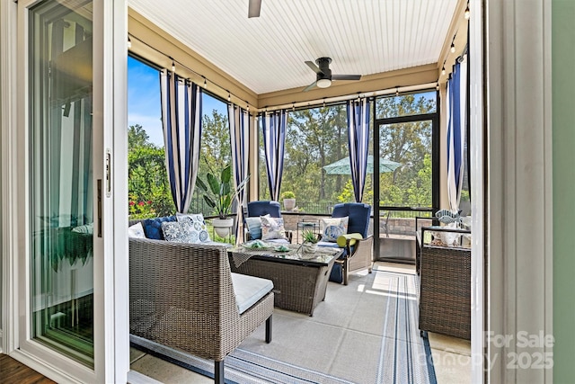 sunroom / solarium with ceiling fan