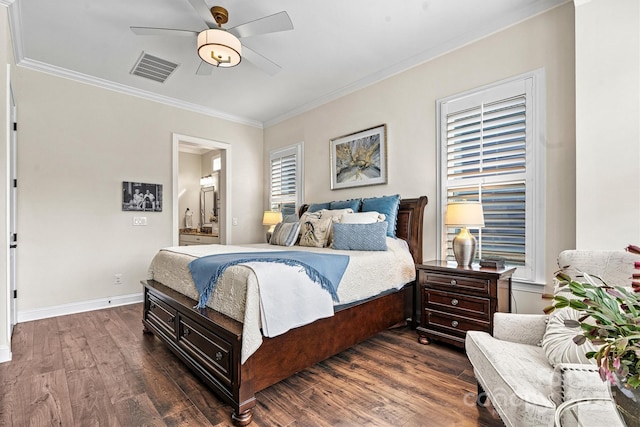 bedroom with ensuite bath, ornamental molding, dark hardwood / wood-style floors, and ceiling fan