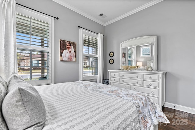 bedroom with crown molding and dark hardwood / wood-style floors