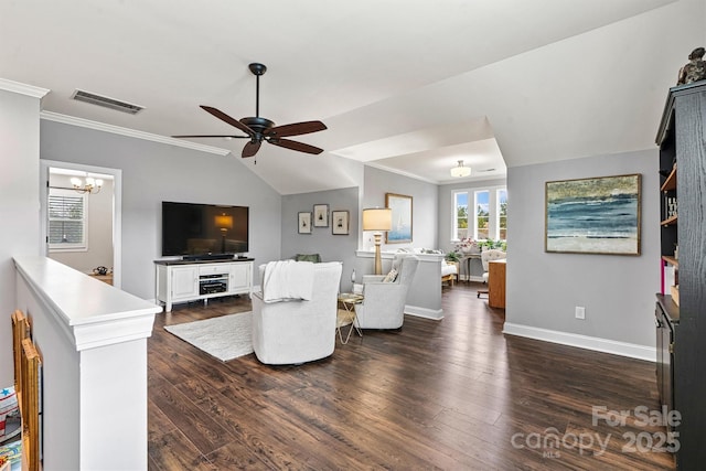 living room with dark wood-type flooring, ornamental molding, ceiling fan with notable chandelier, and vaulted ceiling