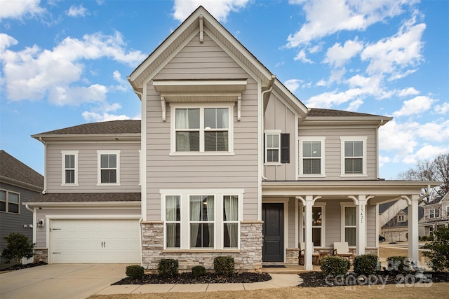 view of front of property featuring a garage and covered porch