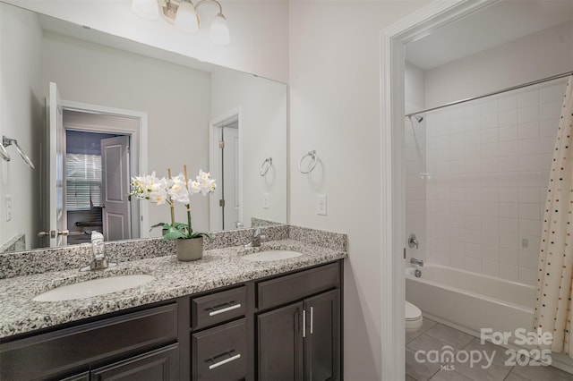 full bathroom with vanity, shower / bathtub combination with curtain, tile patterned floors, and toilet