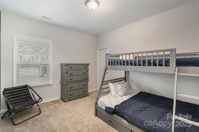 bedroom with light colored carpet