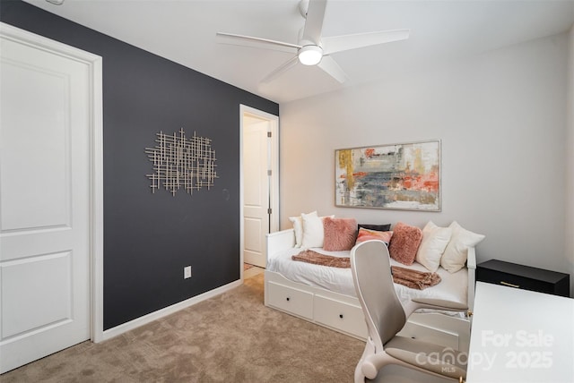 office area with light carpet and ceiling fan