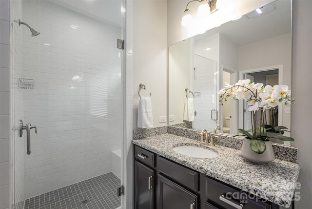 bathroom with vanity and walk in shower