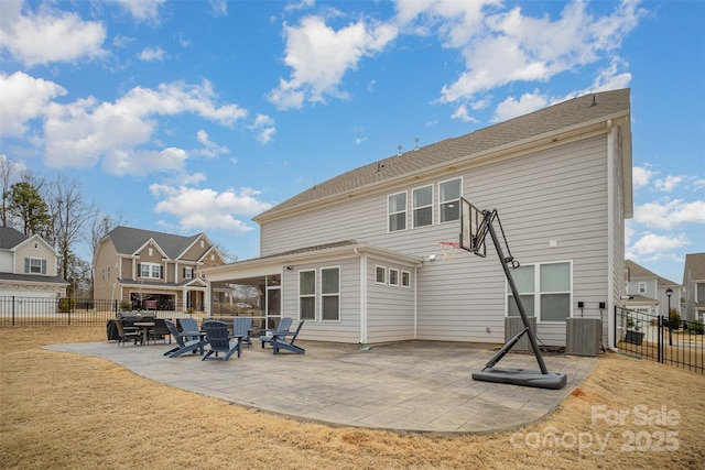 rear view of house featuring central air condition unit and a patio area