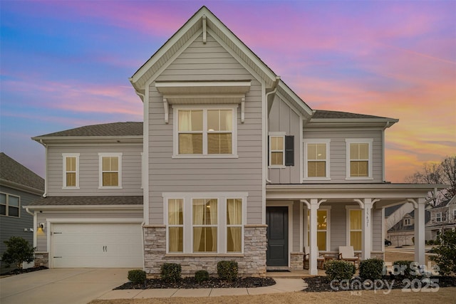 view of front of home with a garage and covered porch