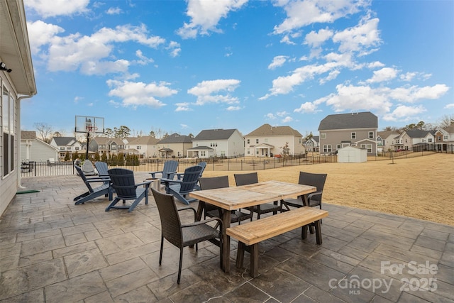 view of patio / terrace with a storage shed