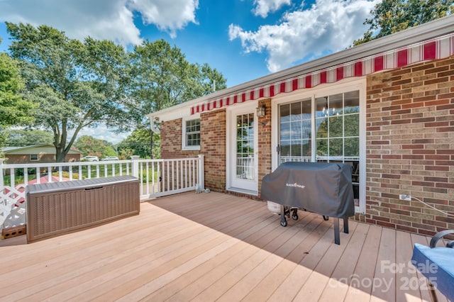 deck featuring a grill