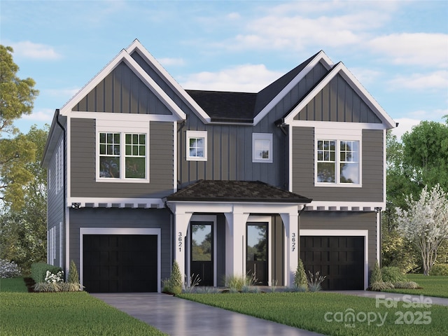 view of front of property featuring a garage and a front lawn