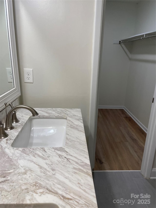 bathroom featuring hardwood / wood-style flooring and vanity