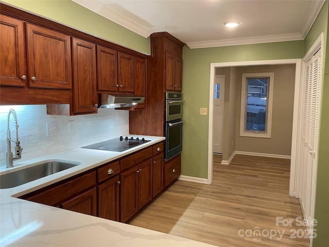 kitchen with double oven, sink, light hardwood / wood-style floors, crown molding, and black electric cooktop