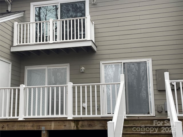 entrance to property with a balcony