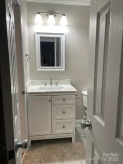 bathroom with vanity, tile patterned floors, and toilet