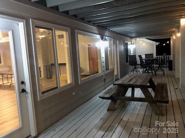 wooden deck with outdoor dining space