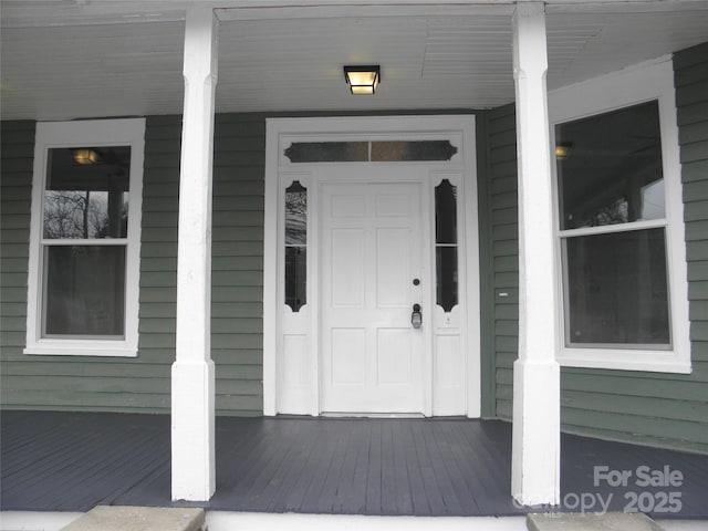 entrance to property with a porch