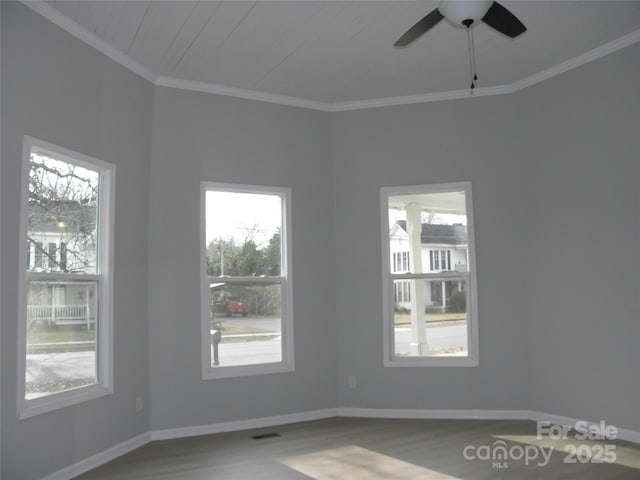 unfurnished room with ceiling fan, ornamental molding, and hardwood / wood-style floors