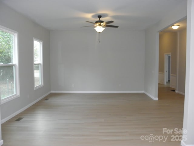 unfurnished room featuring light hardwood / wood-style floors and ceiling fan