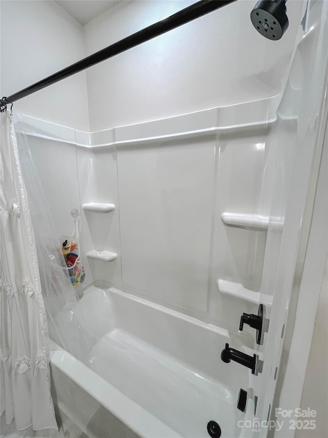 bathroom with shower / bathtub combination with curtain