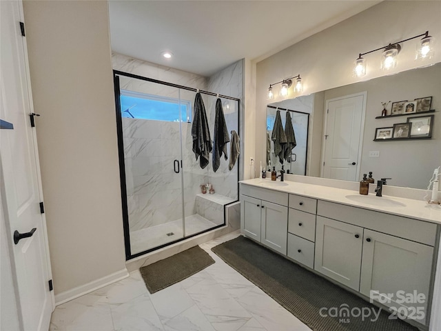 bathroom with vanity and a shower with door