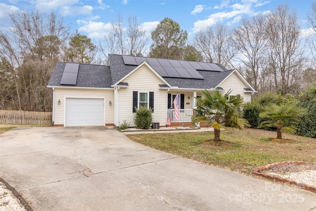 view of front facade with covered porch, a garage, central air condition unit, a front yard, and solar panels