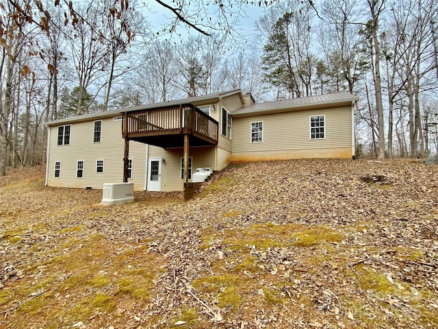 rear view of house featuring a deck