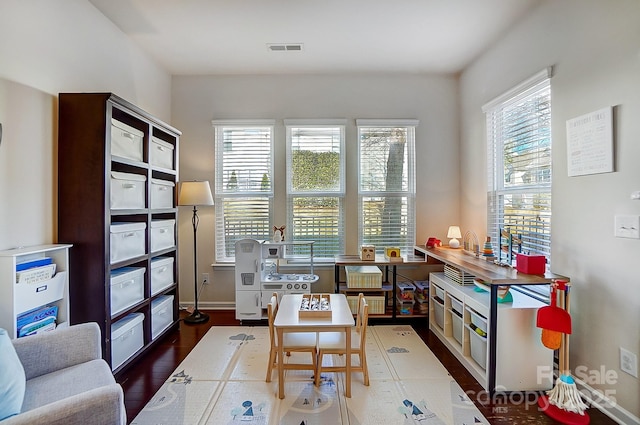 sitting room with dark hardwood / wood-style flooring