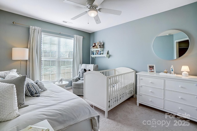 carpeted bedroom featuring ceiling fan