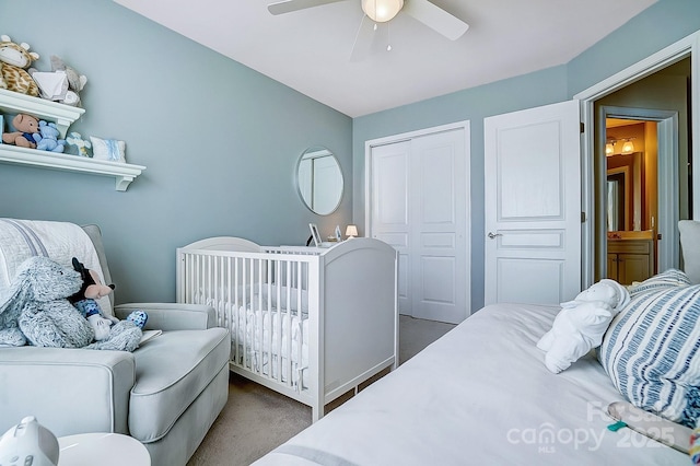 bedroom with ceiling fan, carpet floors, and a closet