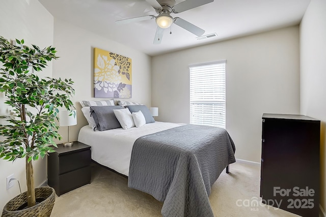 bedroom featuring ceiling fan and light colored carpet