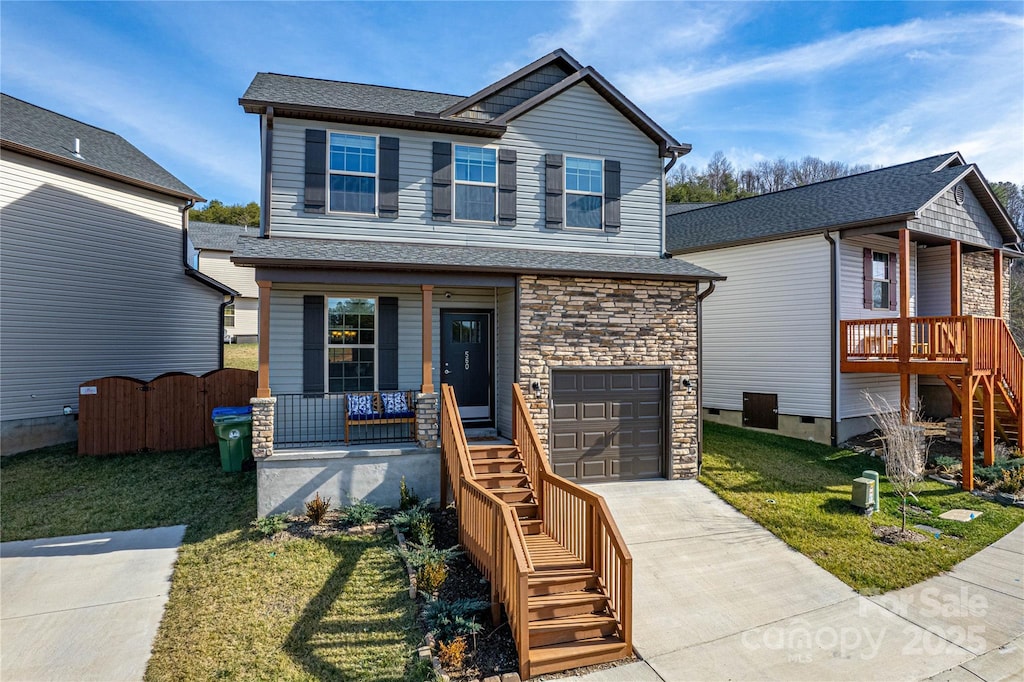 560 Cardwell Ln, Fletcher, NC 28732 - view of front of property with a garage, covered porch, and a front lawn