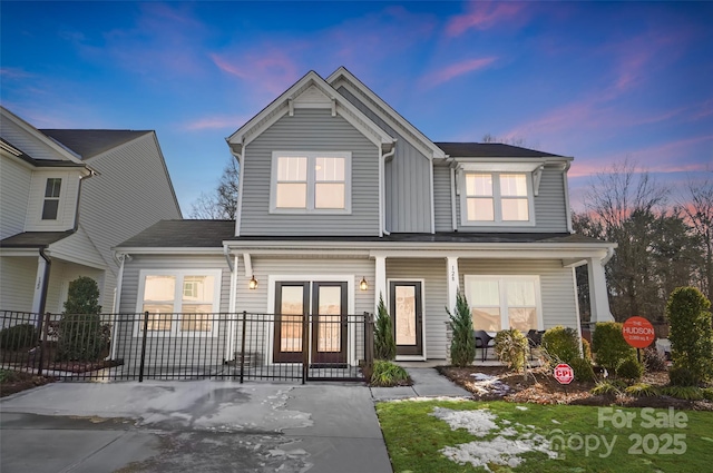 view of front of property with french doors and a porch