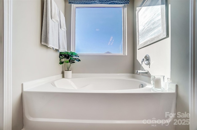 bathroom featuring a tub to relax in