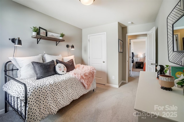 bedroom with light colored carpet