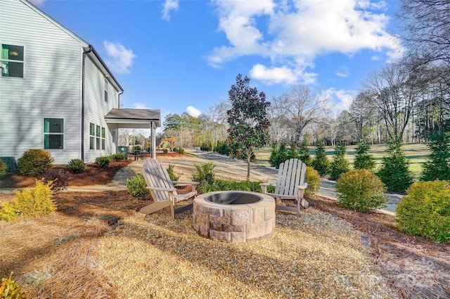 view of yard featuring a patio area and a fire pit