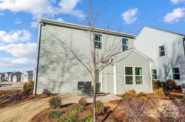 back of house with a patio